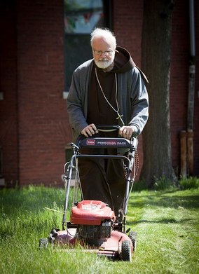 Cardinal O'Malley mowing the lawn.jpg